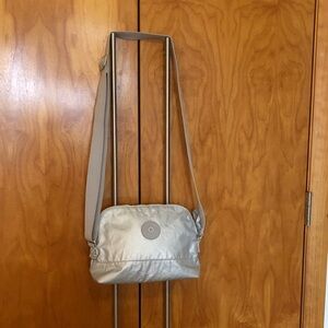 Kipling brand new crossbody silver easy clean no flaws perfect so cute fits alot